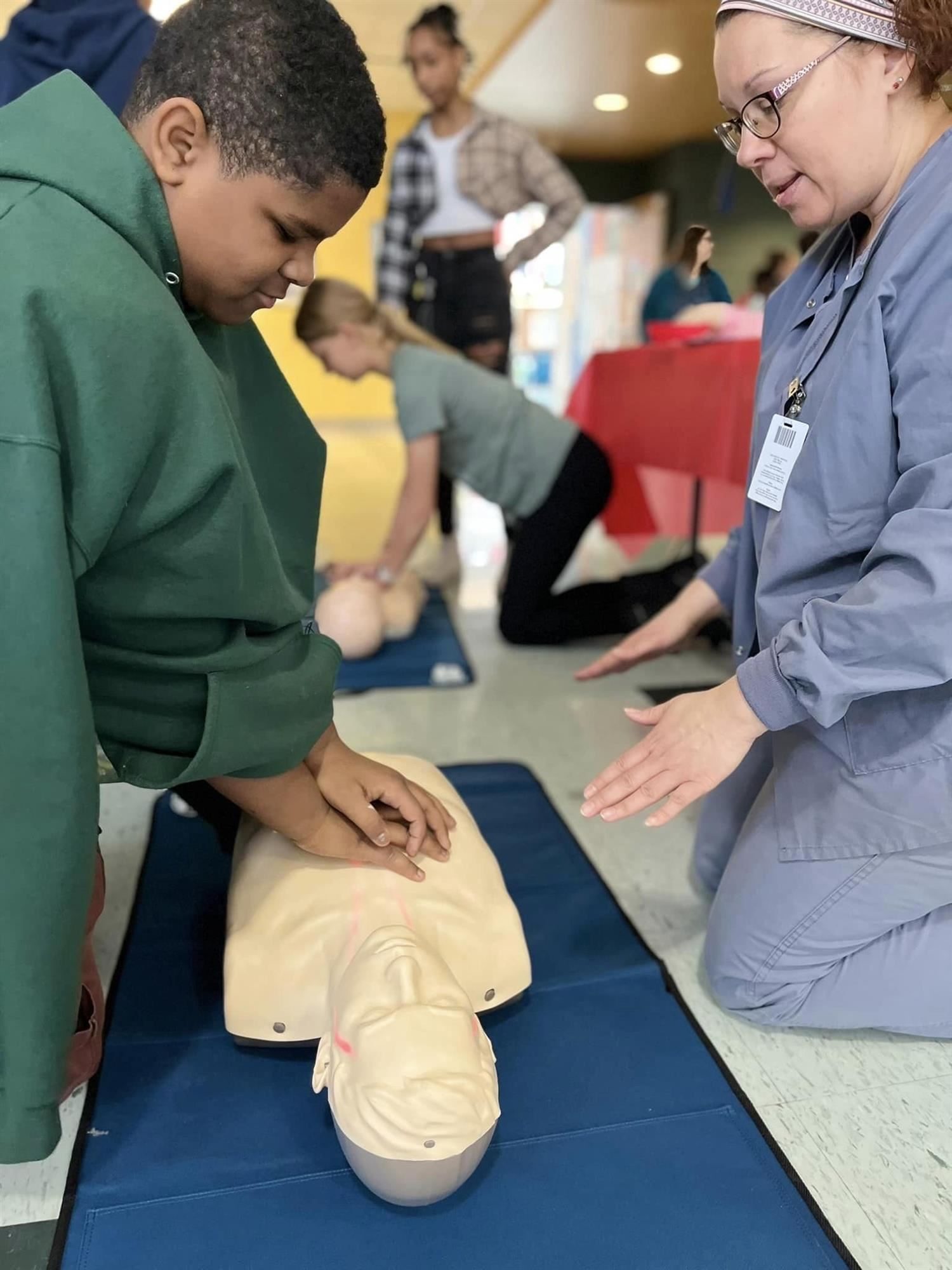 student practicing CPR